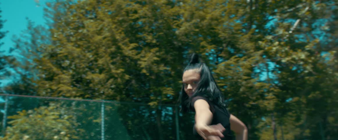 A woman dancing around outside
