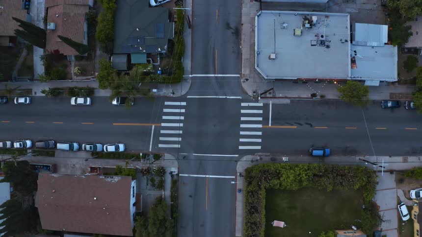 Aerial view of city intersection in the street at dusk
