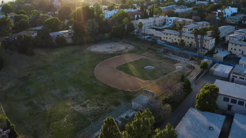 A baseball field is in the middle of the town