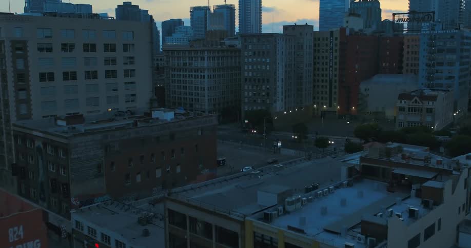 Aerial view of streets with apartment buildings in the city at dusk