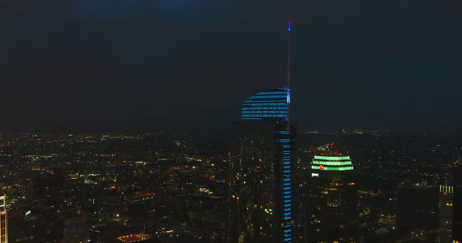 A tall tower is in the middle of the city