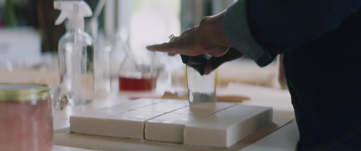 A woman is preparing dessert in a kitchen