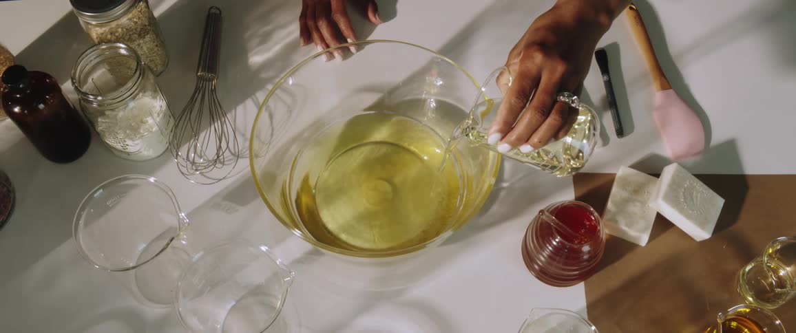A woman is preparing food on a table