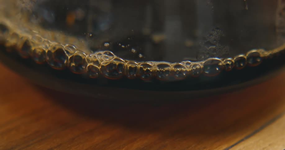 A view of coffee bubbling in a glass