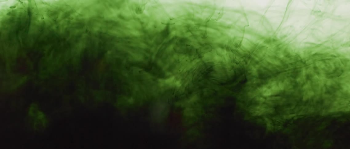 Swirling dark green liquid