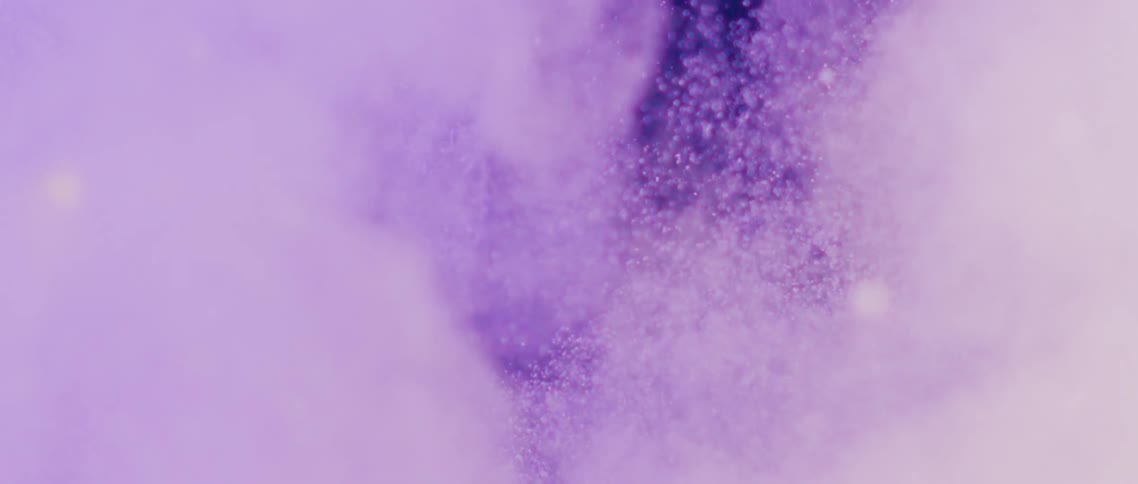Bubbles and clouds of color rise up in liquid