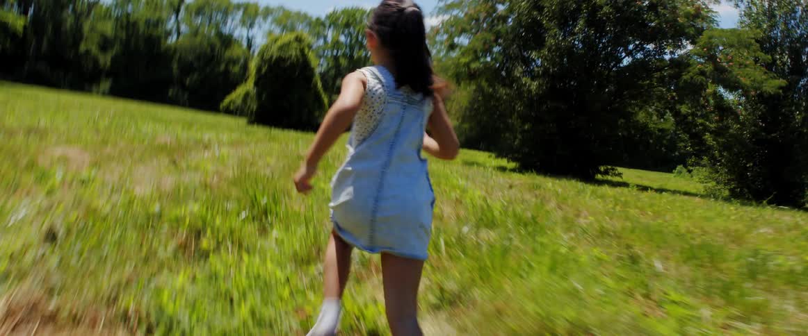 Two children running and playing outside