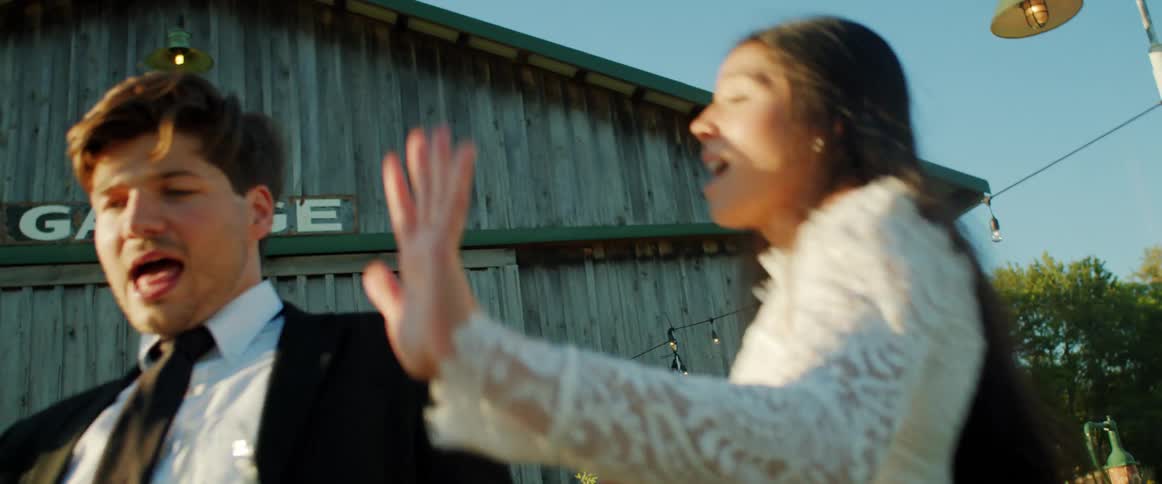 Two people dancing outdoors