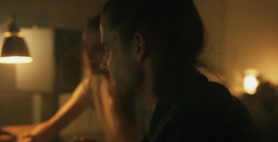 Man and woman chat at a desk