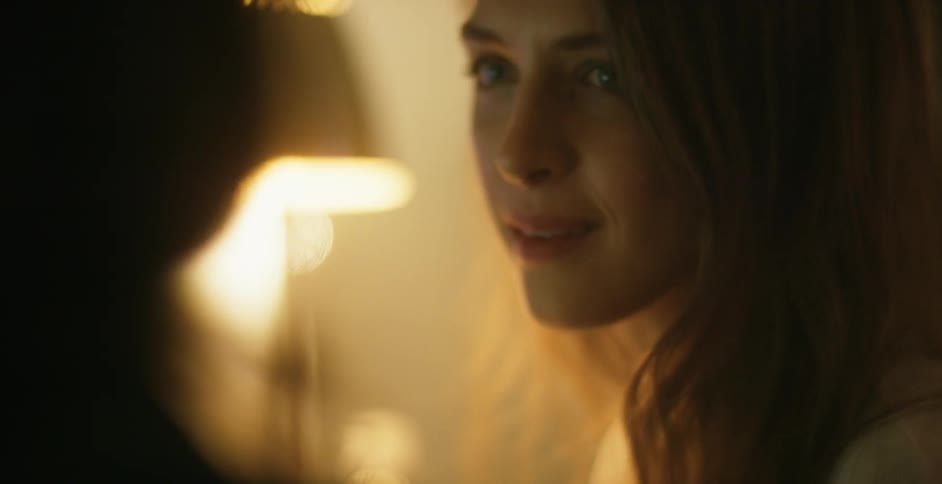 A woman talking to some other people