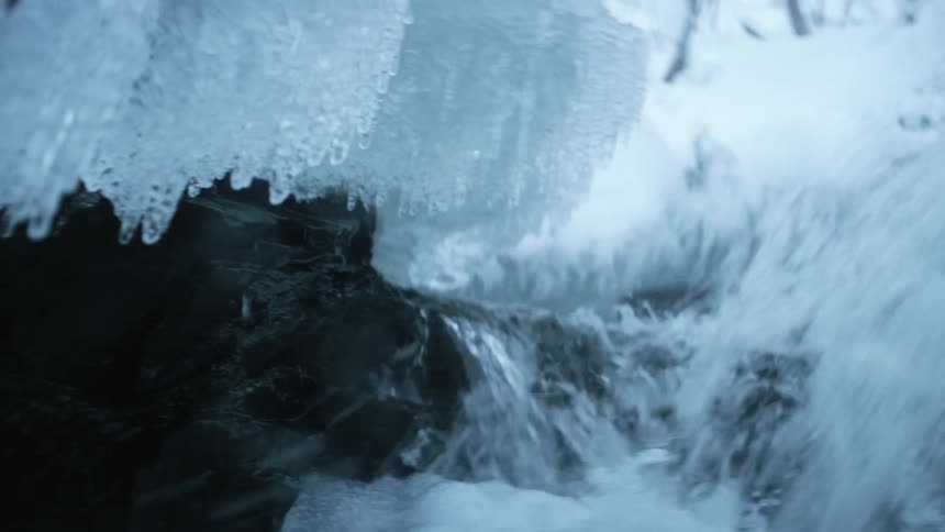 Waterfall surrounded by ice