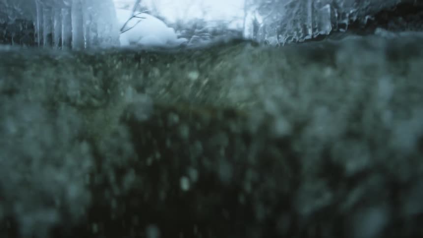 River water flowing through a snowy landscape in nature