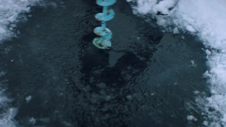 A drill operating in icy arctic water