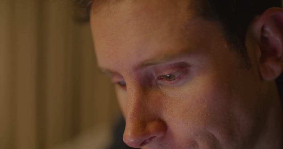 Male crying with hand on face