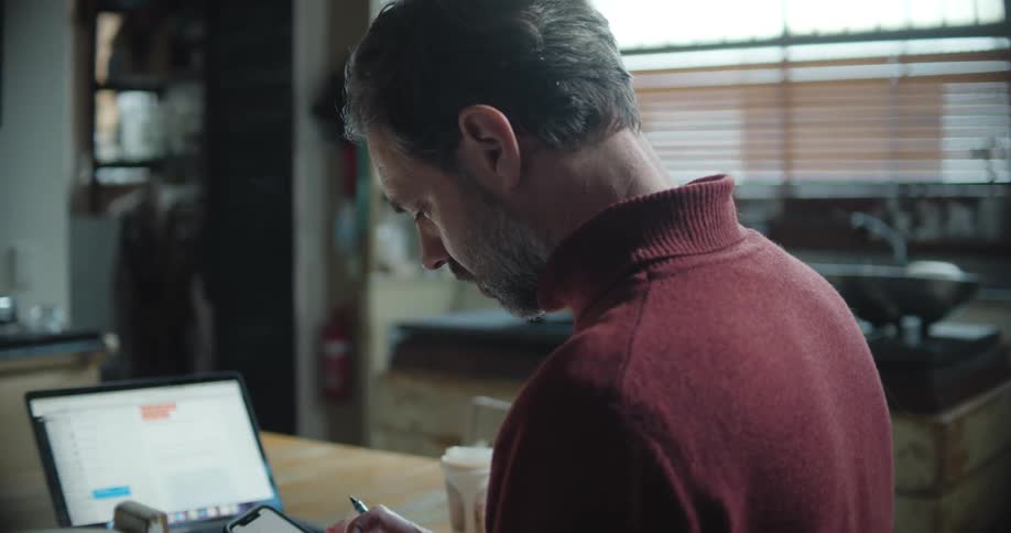 A man typing on a smartphone