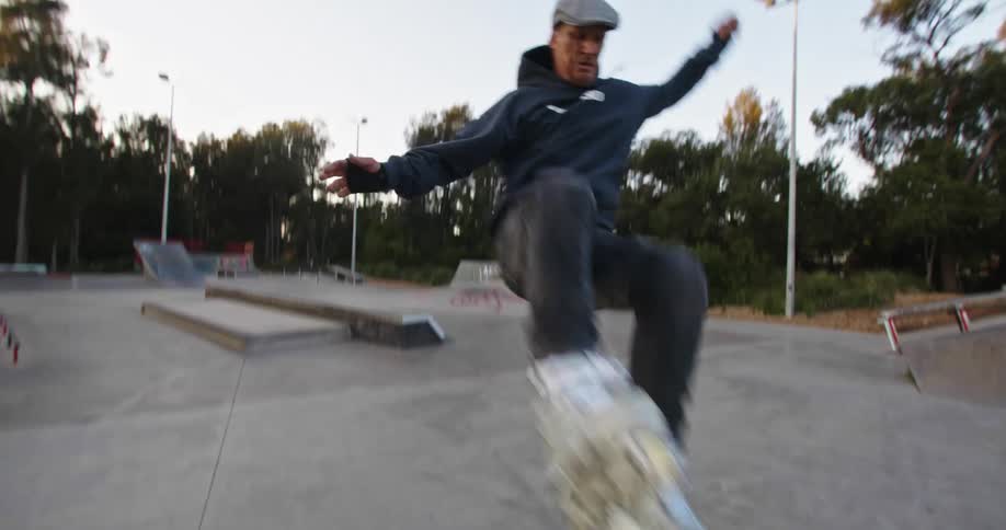 A man riding on roller blades outdoors