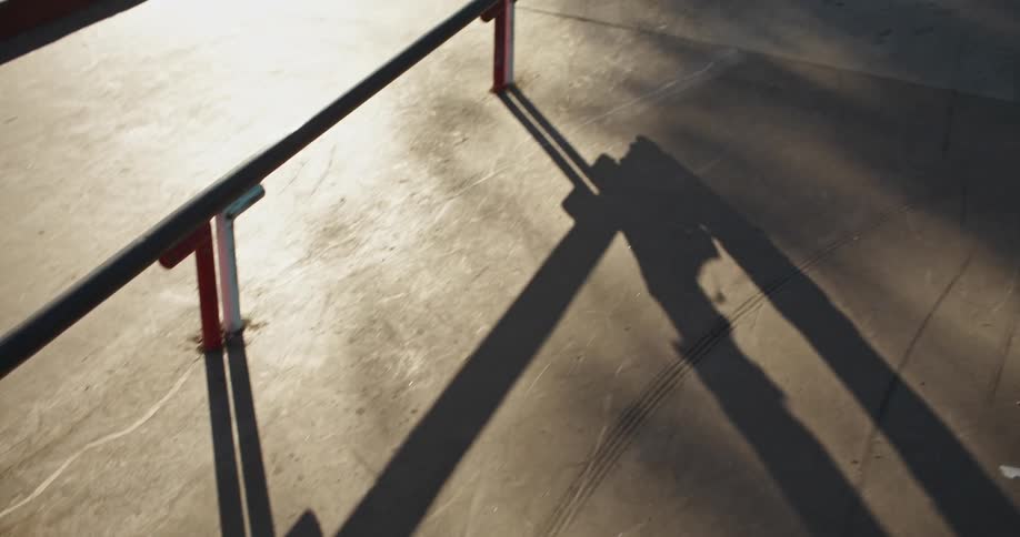 A person is skating at a park during the day