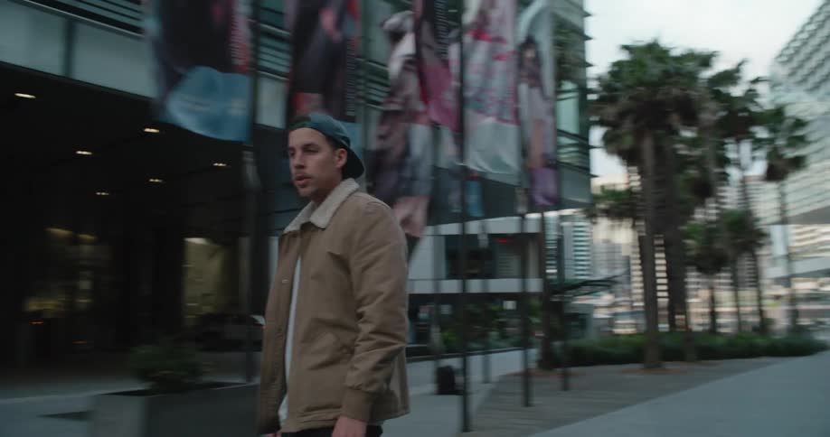 A man riding a skateboard in a city