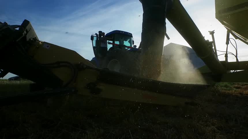 Farm vehicles process grain