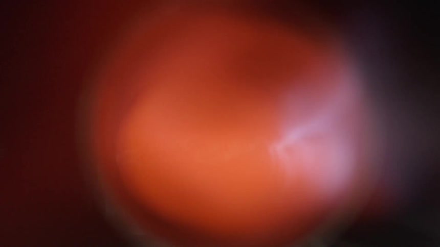 Black gray and red colors  from an explosion flame coming out of a muffler