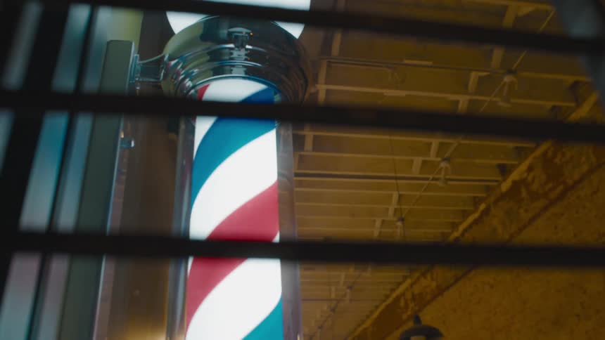 The barber shop sign is spinning outside