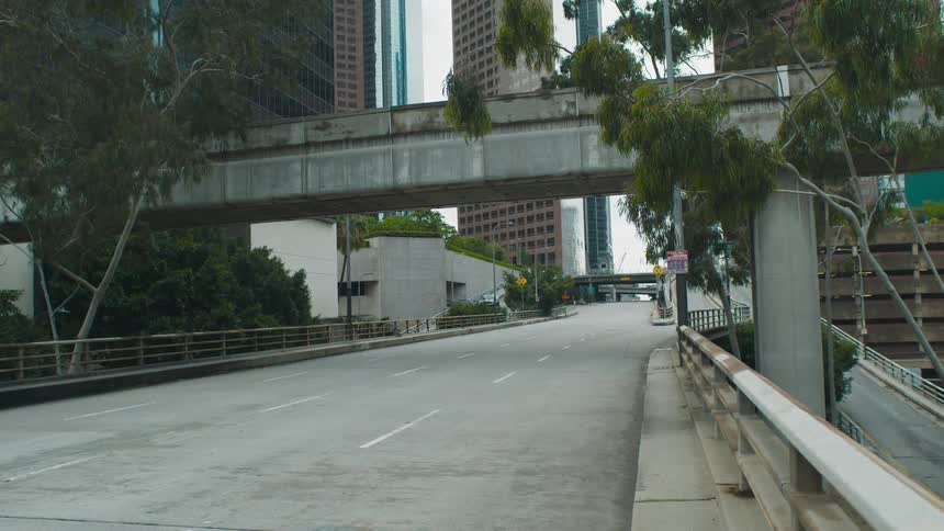 A downtown city is displayed with an empty street