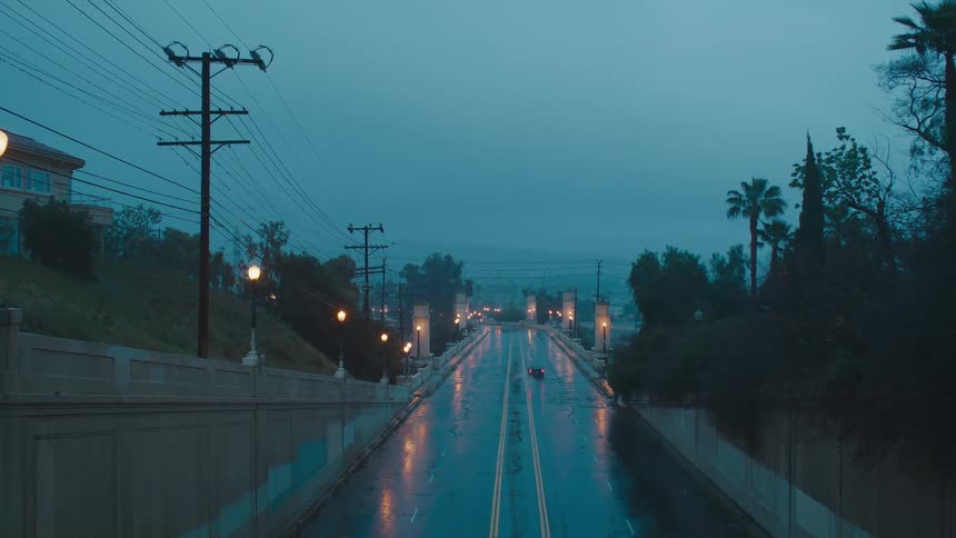 Cars driving on a rainy street
