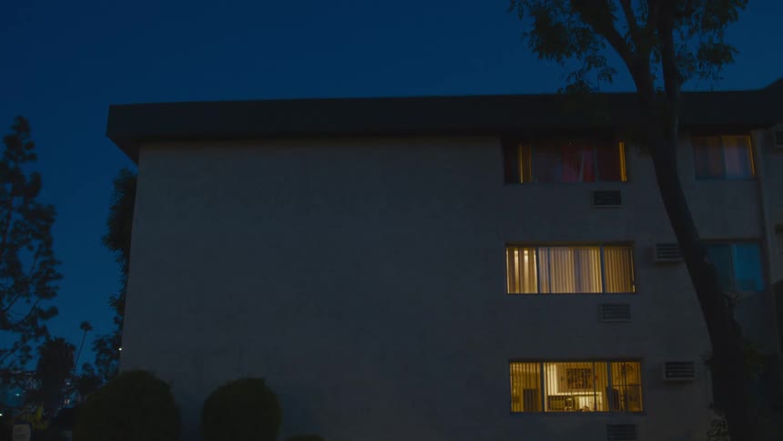 The facade of a residential building at night