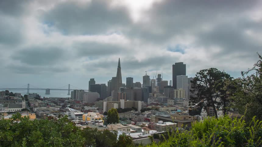 Time lapse of clouds moving over a city