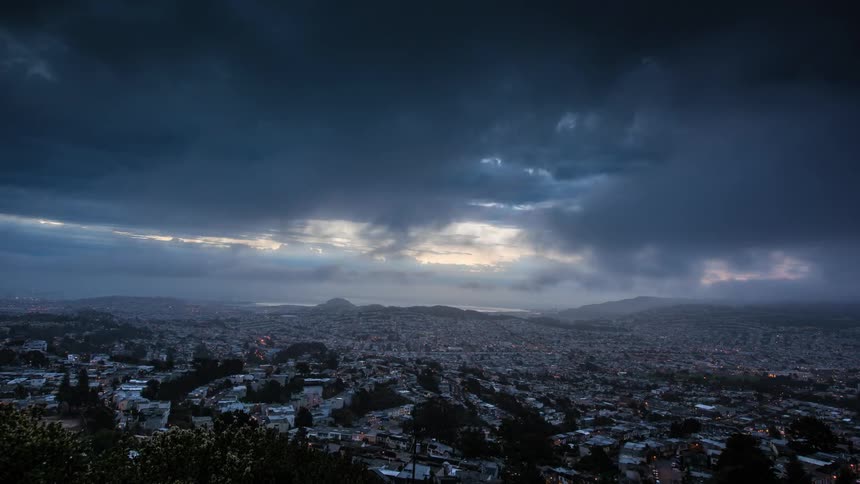 Timelapse of a sky over a city on a cloudy day