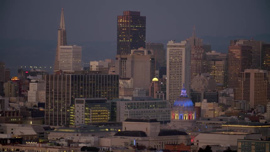 A city is lit at dawn