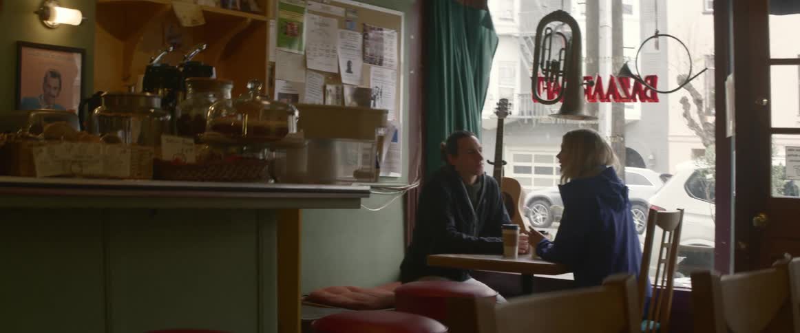 A couple chatting in a coffee shop