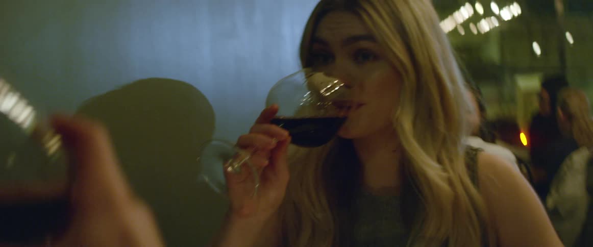 Two people toast and have a drink