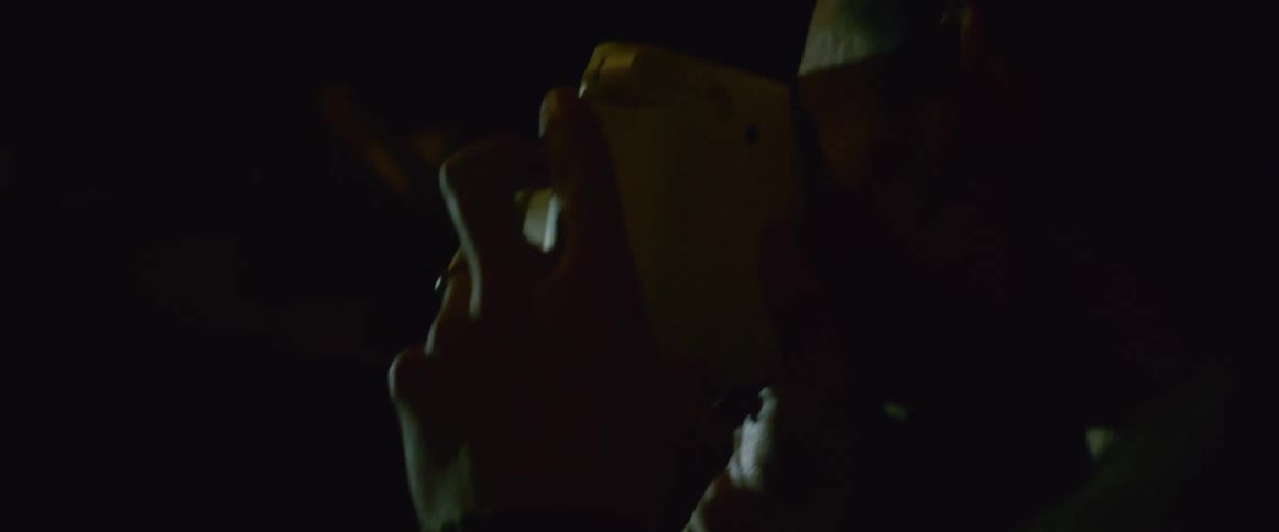 A man takes pictures in the dark