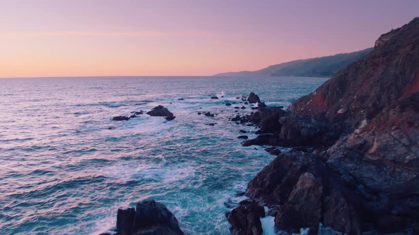 An aerial shot of a rocky coastline