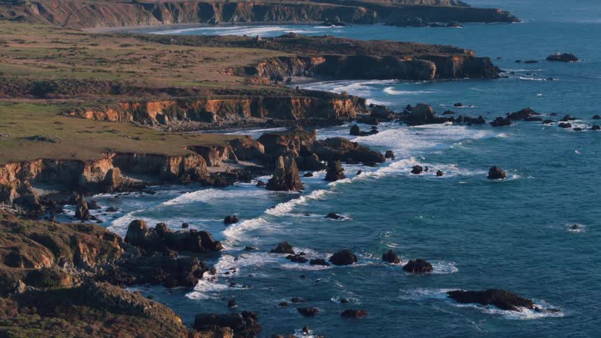 Waves crash on a rocky shoreline