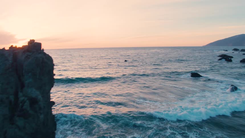 Seaside cliffs as sunsets over ocean
