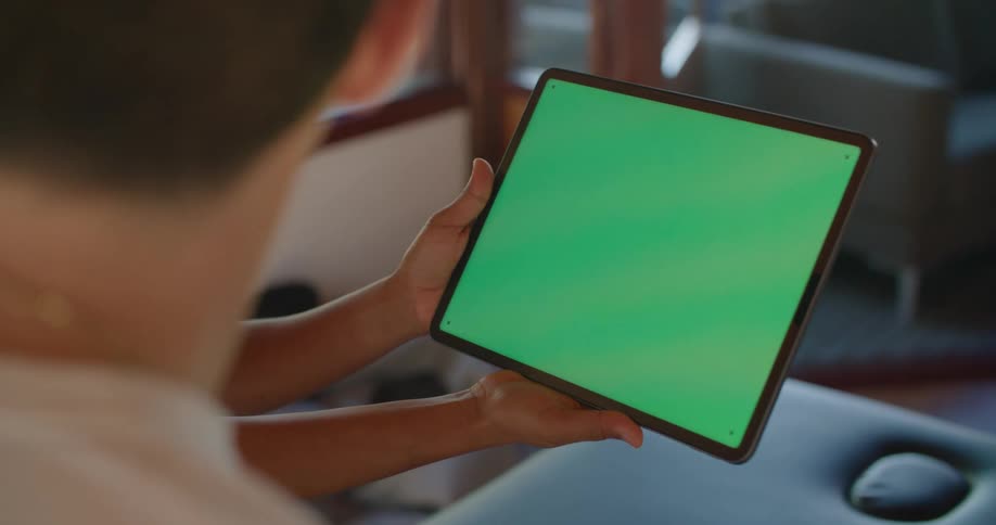 Two people staring at a tablet