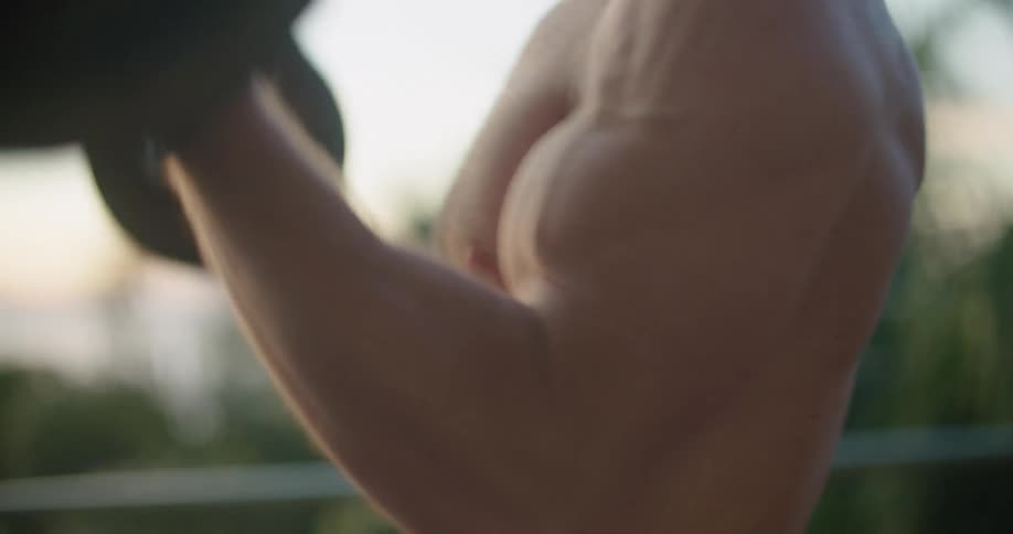 A man lifting weights outdoors