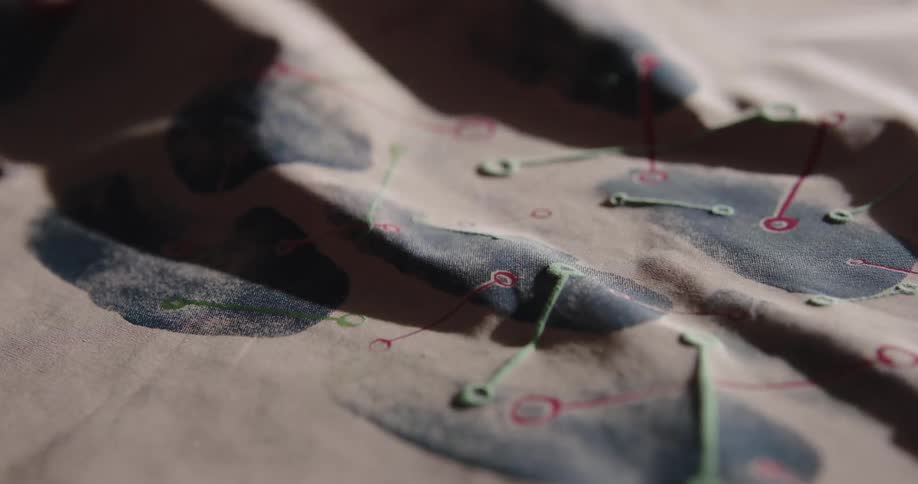 Painted fabric is heated with a dryer causing some of the paint to puff up