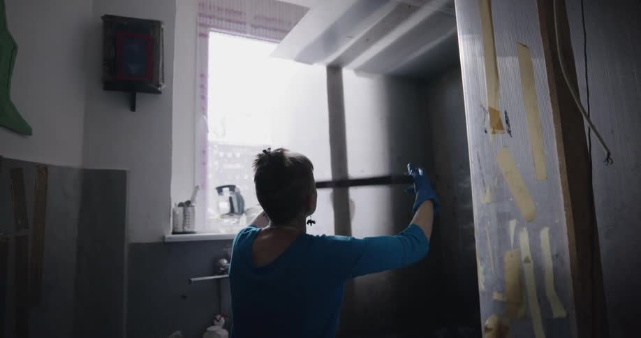 Woman looking at window