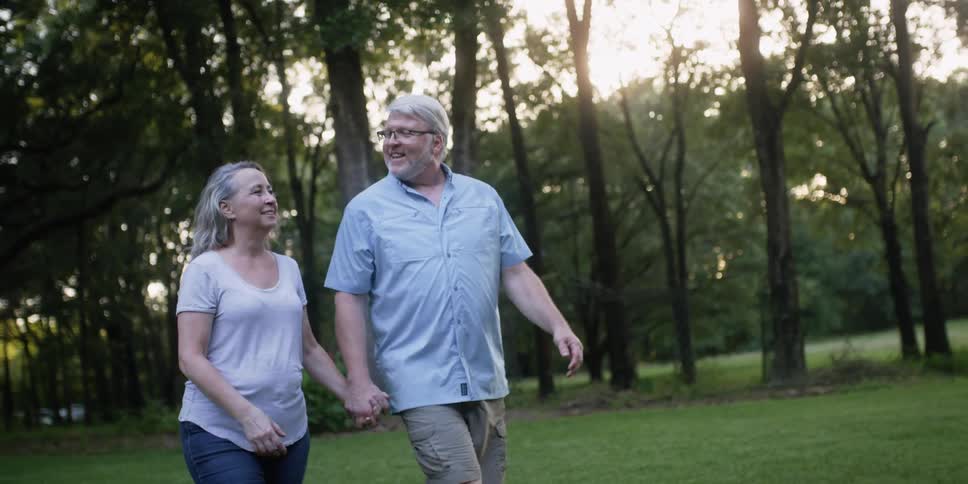A man and woman walking together outdoors