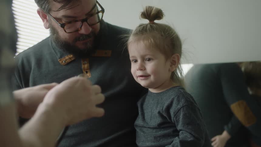 A doctor checking a child at an office