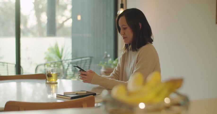 Woman typing on phone