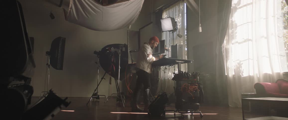 A man is working in a studio