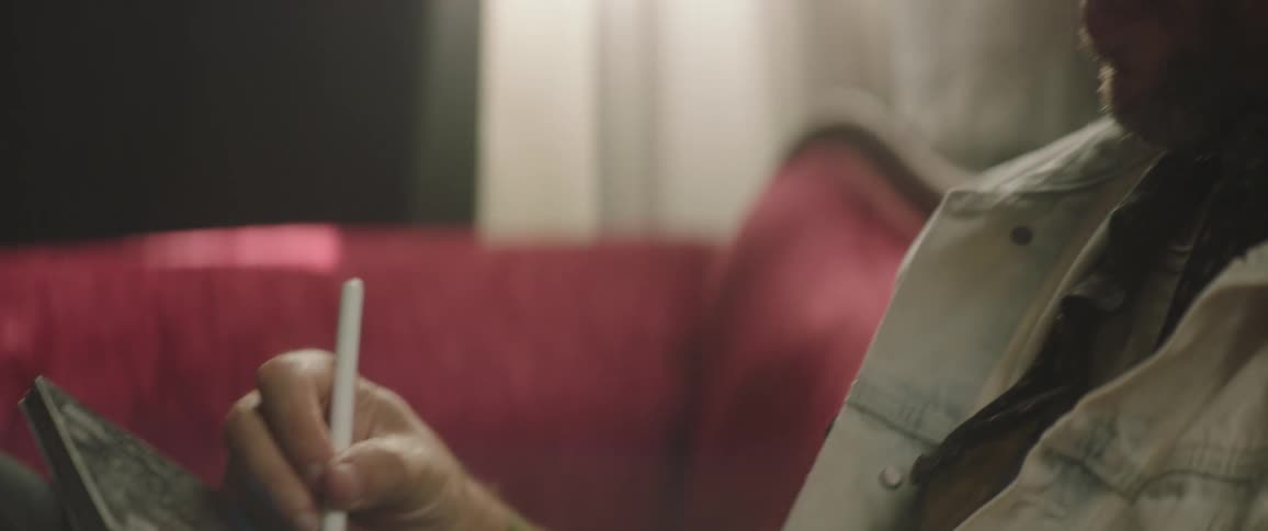 A man using a tablet with a pen