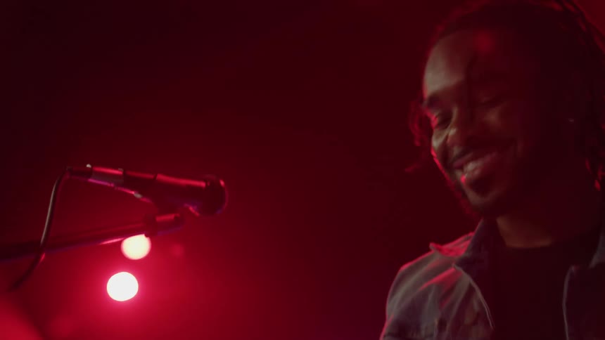 A musician playing music on stage