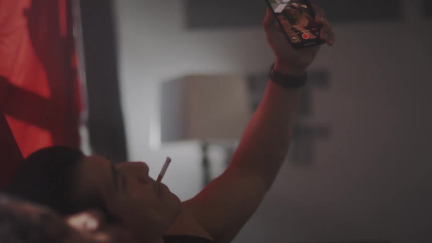 Man moves over to sit closer to woman to take selfie