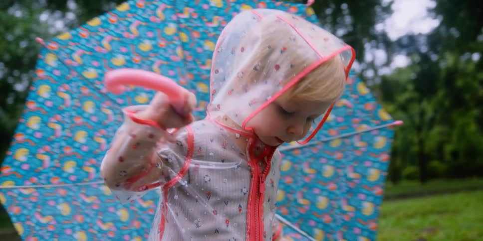 A child playing in a puddle