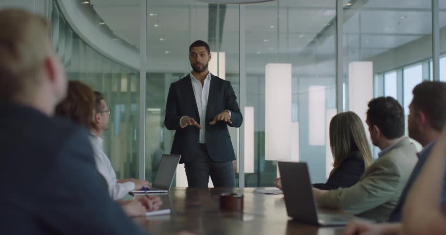 Man talking to a group of workers